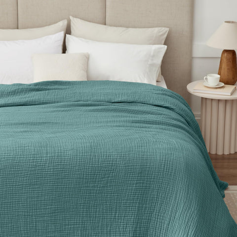 Kozyhvn king blanket on teal bed, ideal for all-season use.