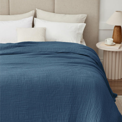 Kozyhvn muslin blanket 66x90 highlights breathable cotton for year-round comfort.