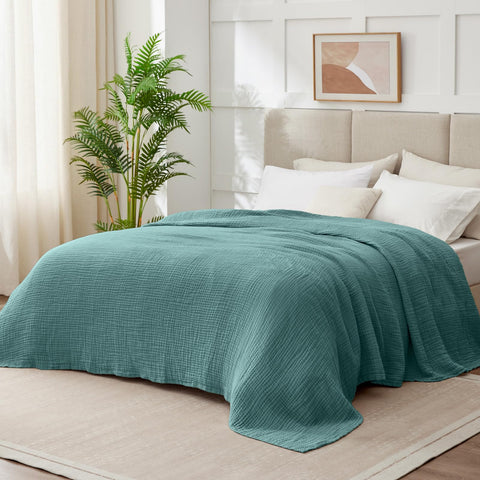 Kozyhvn six-layer gauze weave close-up highlights airy texture and lightweight warmth.