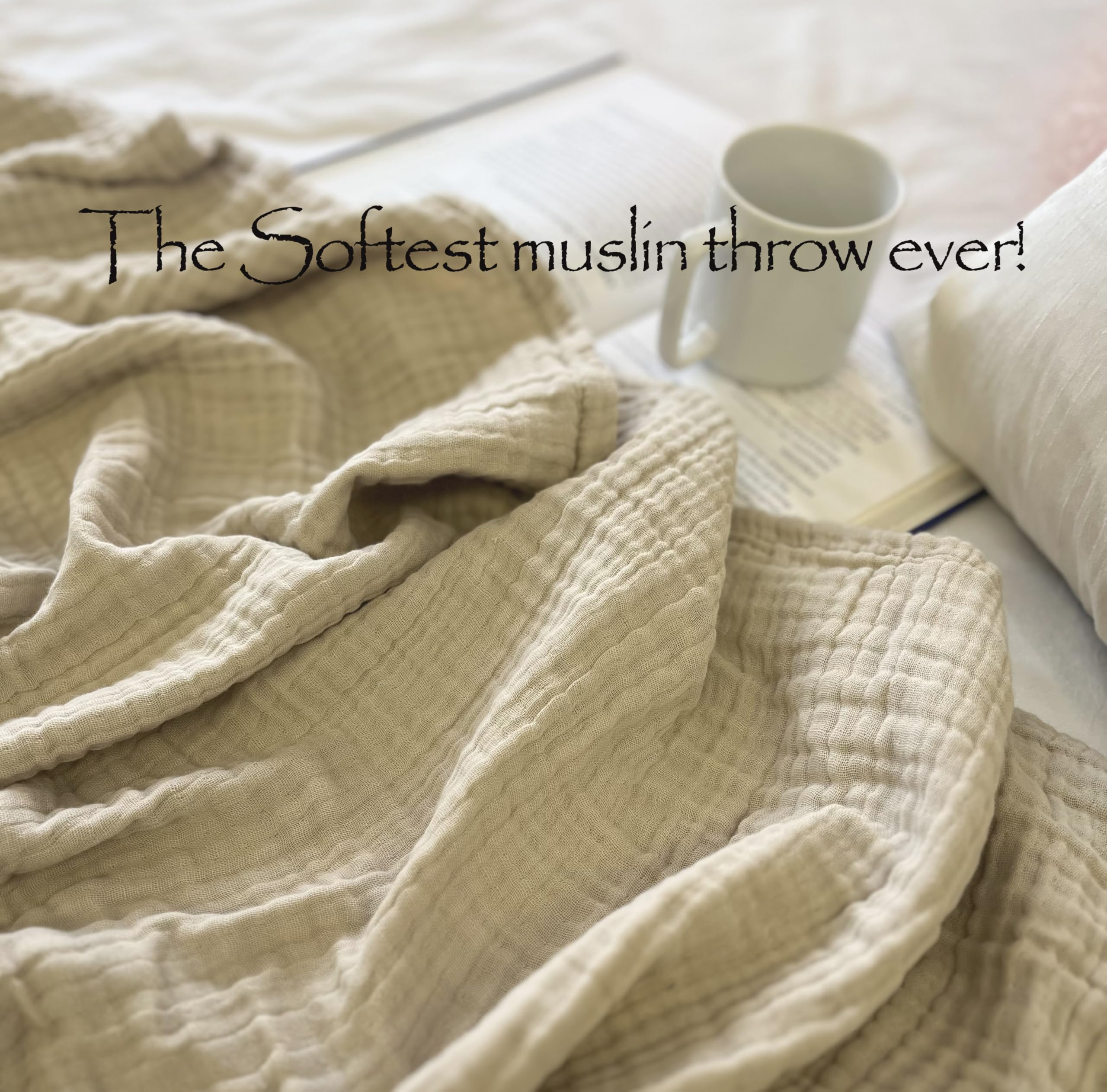Living room setup with KyraHome muslin blanket draped over sofa.