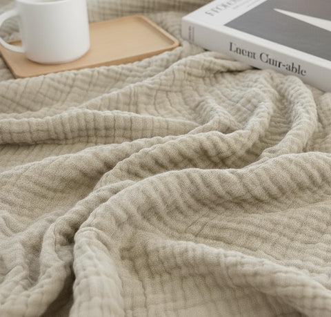KyraHome muslin blanket softness after washing with gentle fibers.