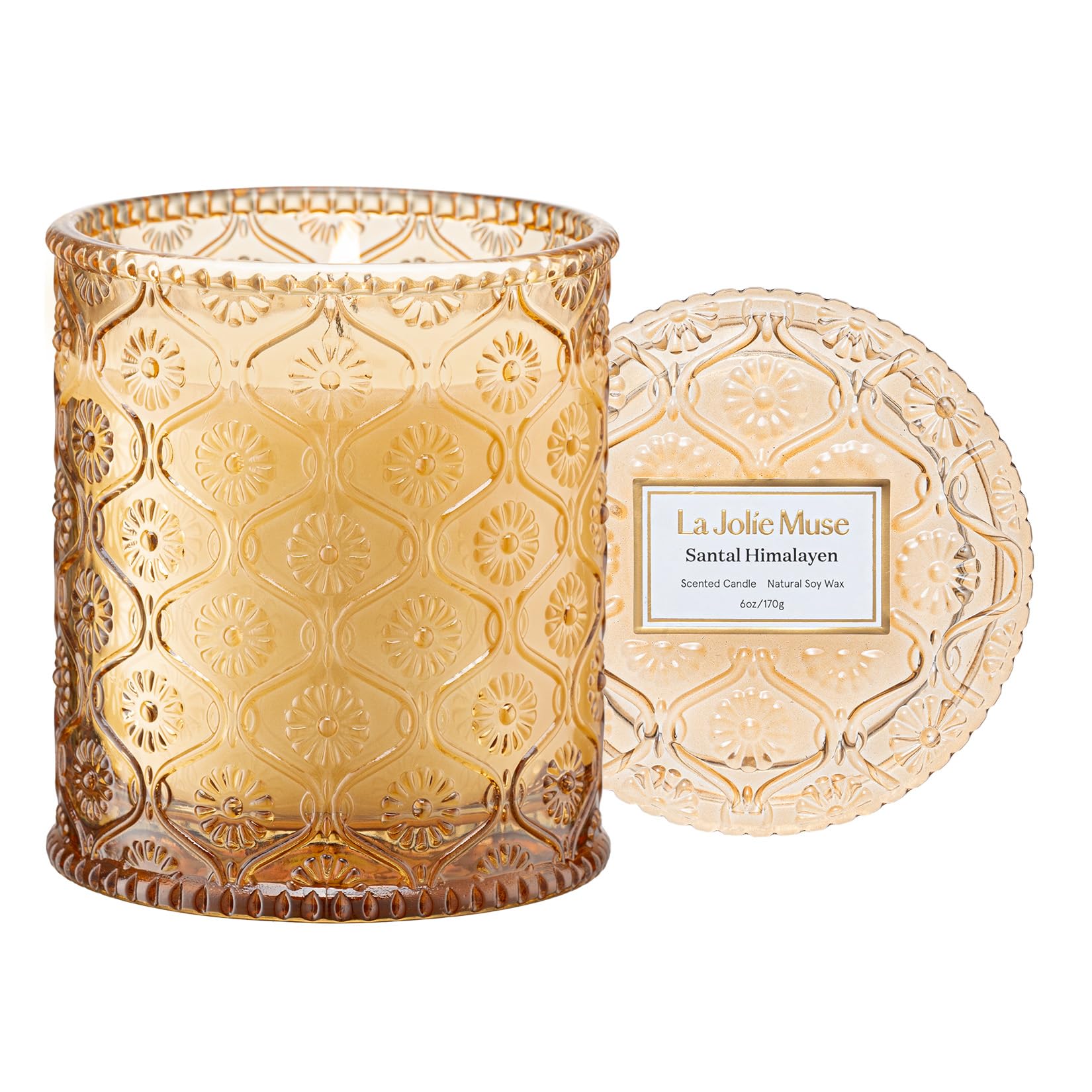 LA JOLIE MUSE amber-sandalwood candle jar offers warm ambience for evenings.