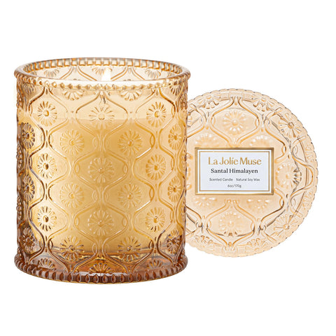 LA JOLIE MUSE amber-sandalwood candle jar offers warm ambience for evenings.