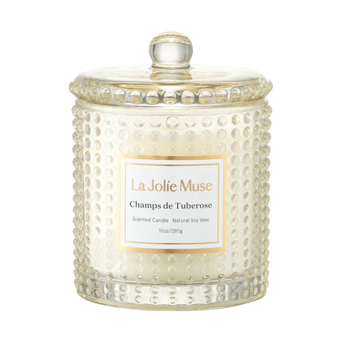 LA JOLIE MUSE Champs de Tuberose candle in hobnail glass jar glowing warmly for evenings