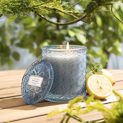 Warm glow from LA JOLIE MUSE Citrus Mint Candle during a calm evening.