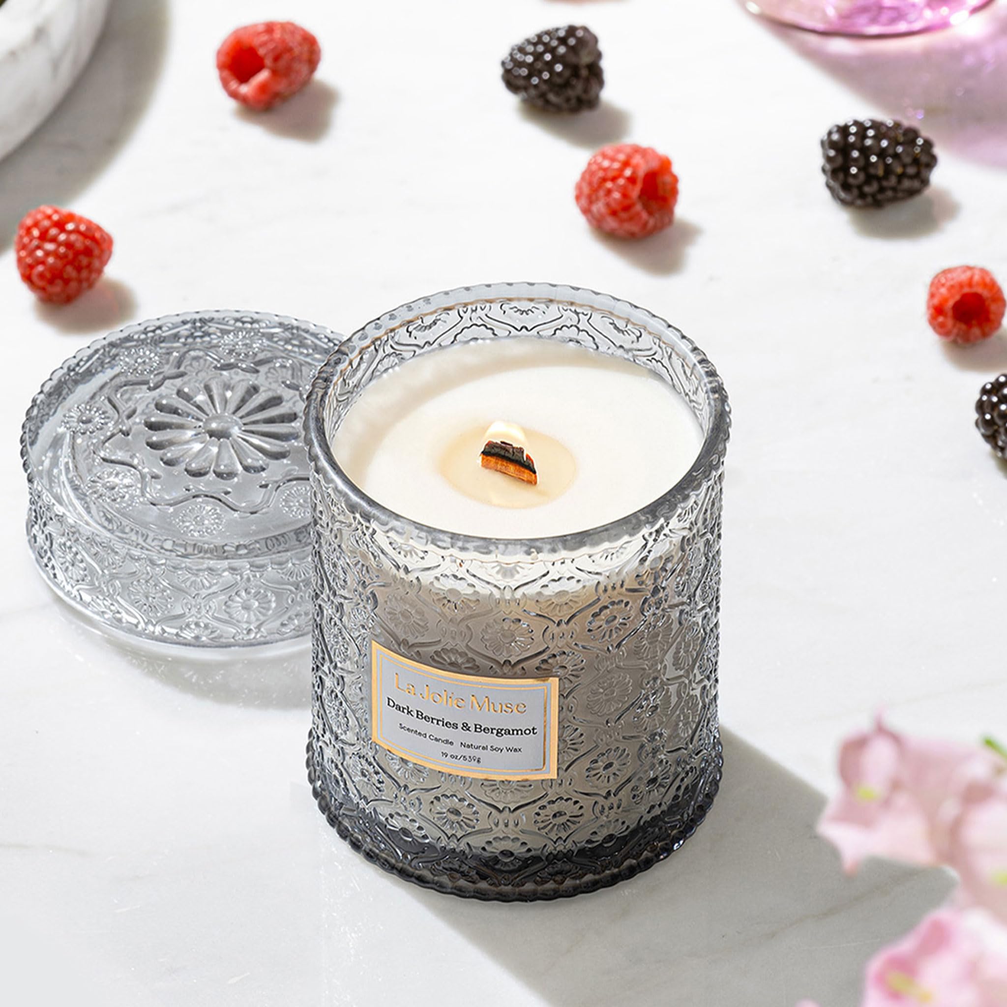 LA JOLIE MUSE embossed-daisy jar adds elegant décor while fragrance fills the room.