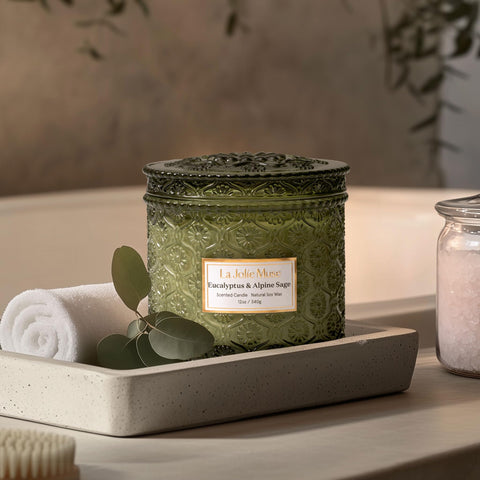 Embellished embossed-daisy jar from LA JOLIE MUSE signals luxury decor and scent.