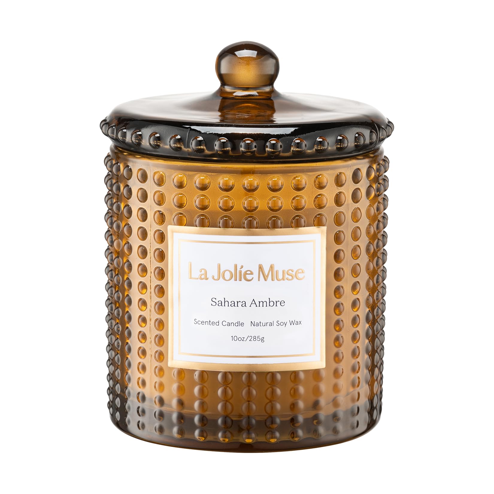 LA JOLIE MUSE Sahara Amber Candle in hobnail jar creates a warm ambiance for cozy evenings.