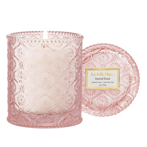 LA JOLIE MUSE Santal Rose candle in an embossed jar enhances elegant home décor.