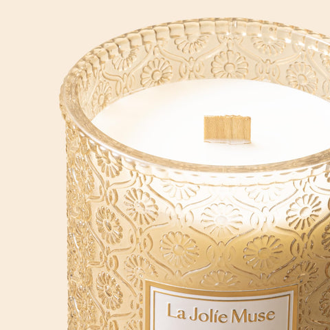 LA JOLIE MUSE Vanilla Bomb Candle lit in a warm living room scene