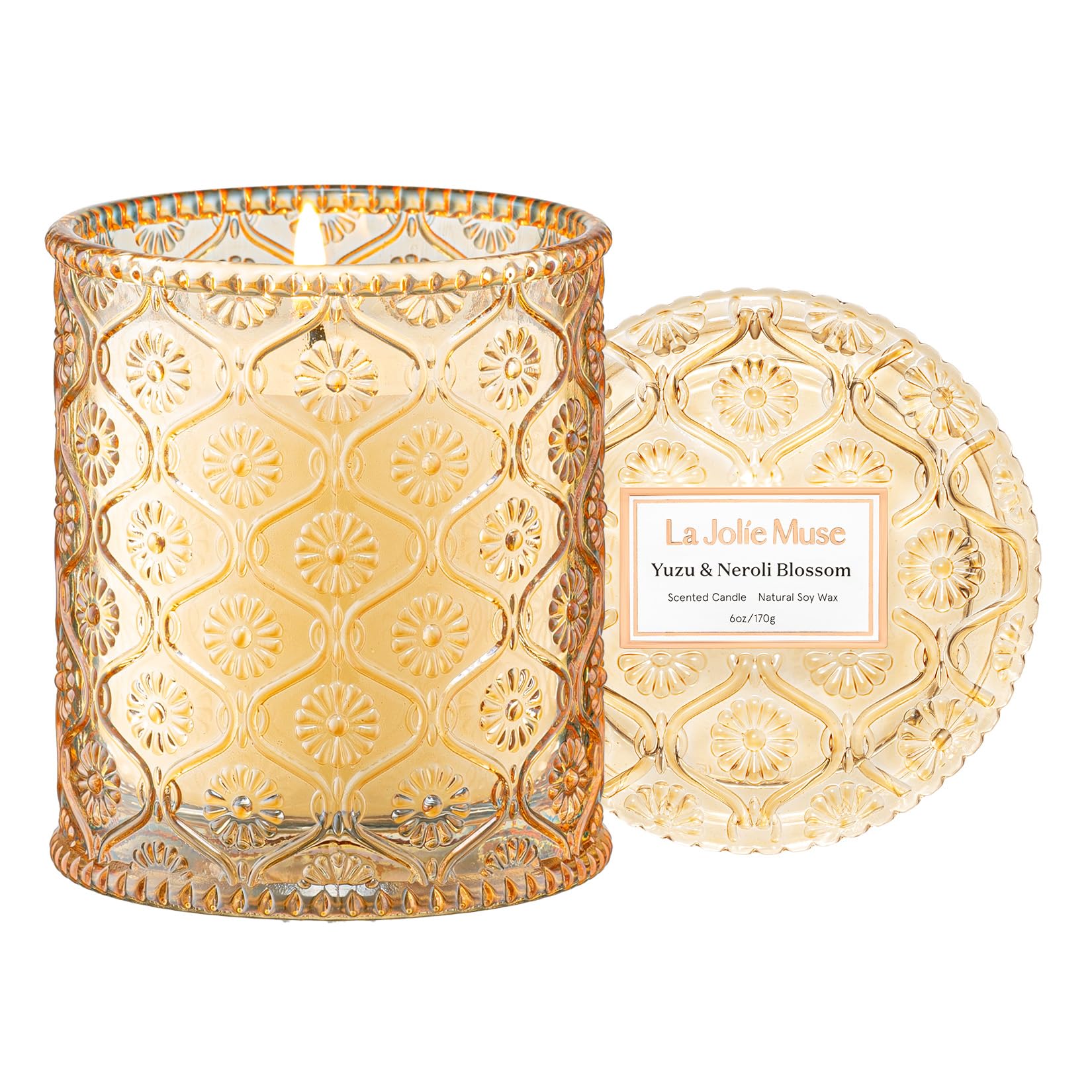 LA JOLIE MUSE Yuzu & Neroli Blossom Candle in decorative glass jar enhances home decor.
