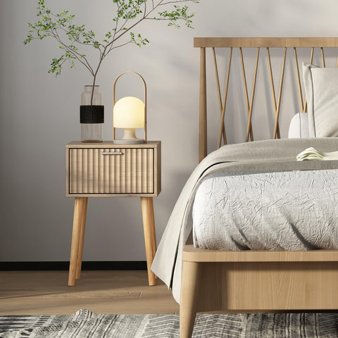 LAATOOREE nightstands with fluted doors provide private storage near seating area