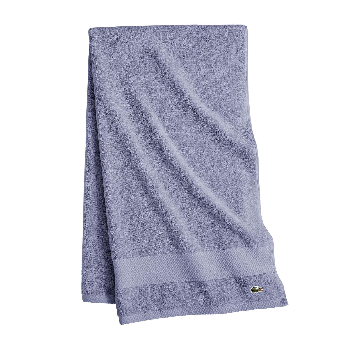 Lacoste Heritage towel border detail highlighting Supima softness and color retention.