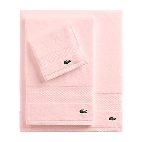 Lacoste Heritage crocodile logo on the towel for brand recognition.