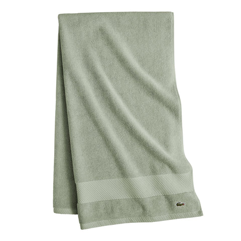 Lacoste Heritage Aloe towel in a bathroom scene suggests spa-worthy softness