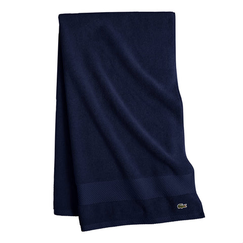 Lacoste Heritage towel navy folded ready for gifting.