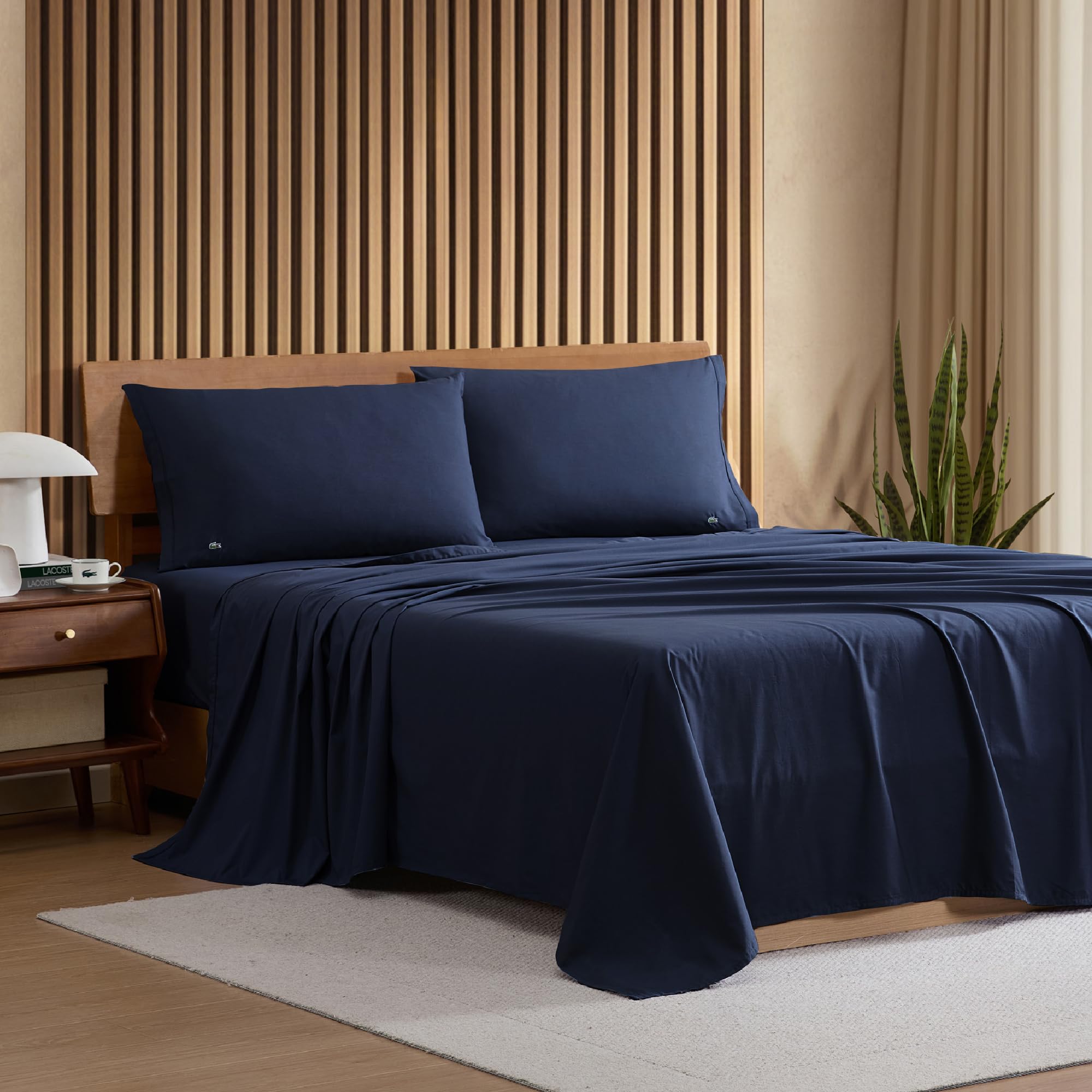 Lacoste navy pillowcases highlight a soft matte finish and durability