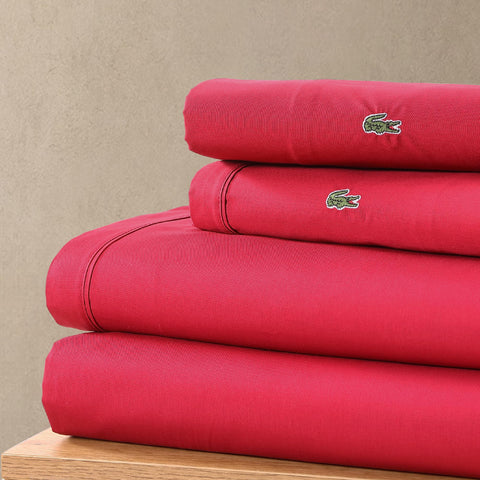 Pillowcases from Lacoste set feature durable stitching and soft matte finish.