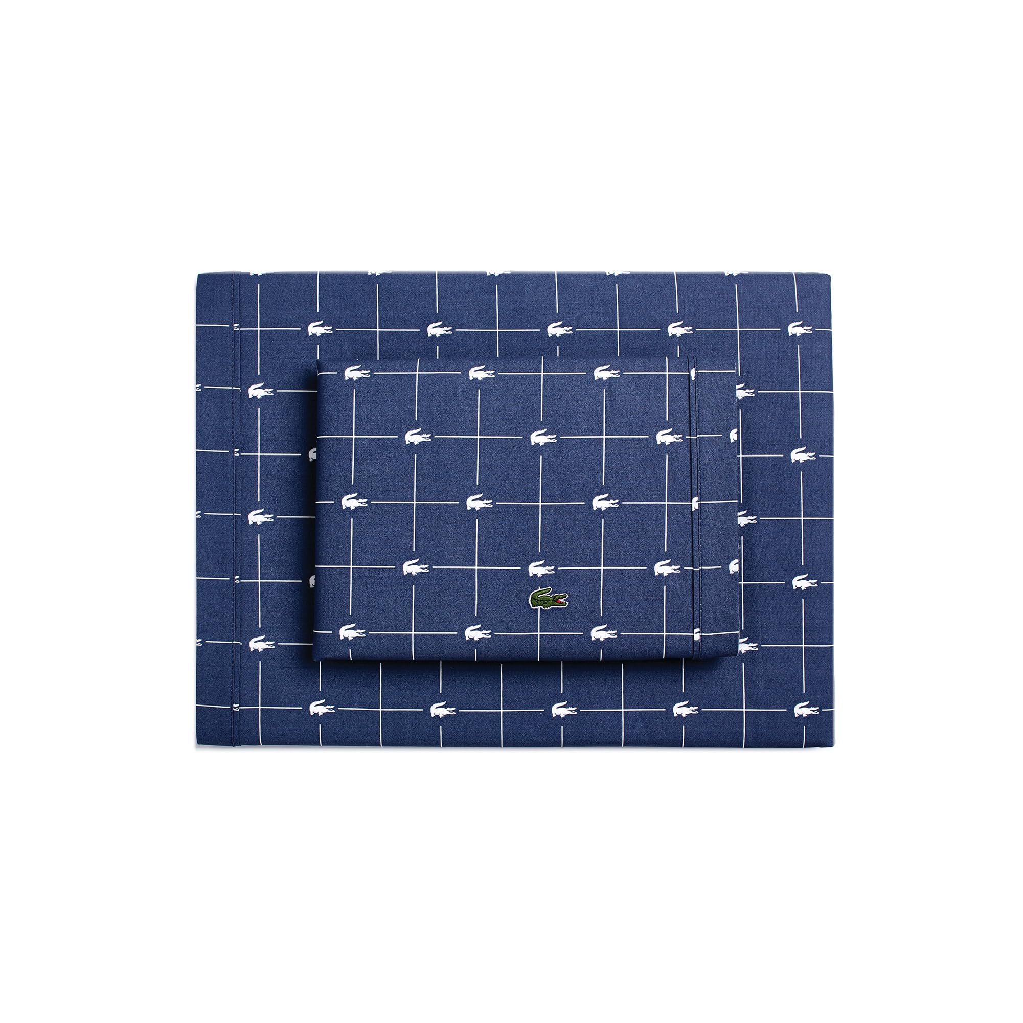 Lacoste Slice sheet set close-up showing breathable 100% cotton percale in vintage indigo.