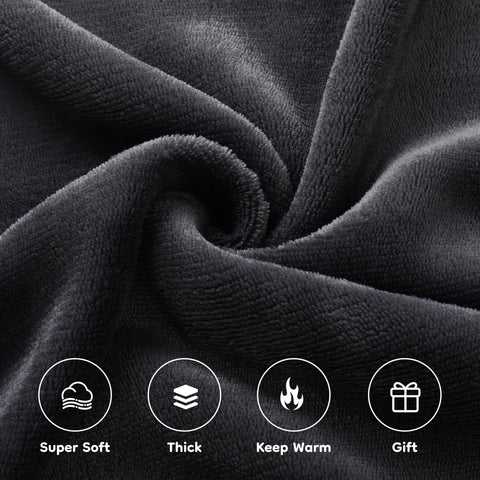 LaffyLo blanket in dark grey on a sofa for cozy downtime