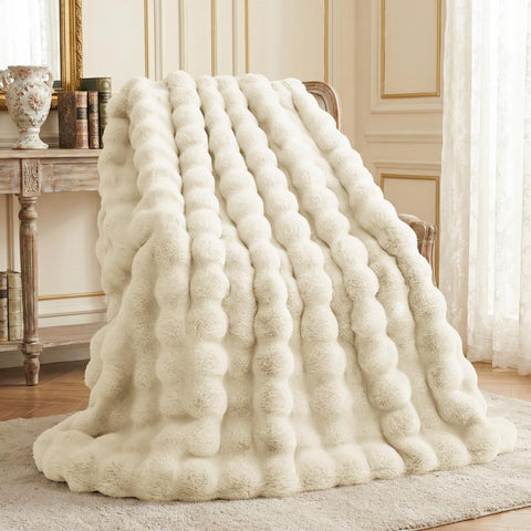 L'AGRATY faux rabbit fur blanket almond white adds cozy couch warmth.