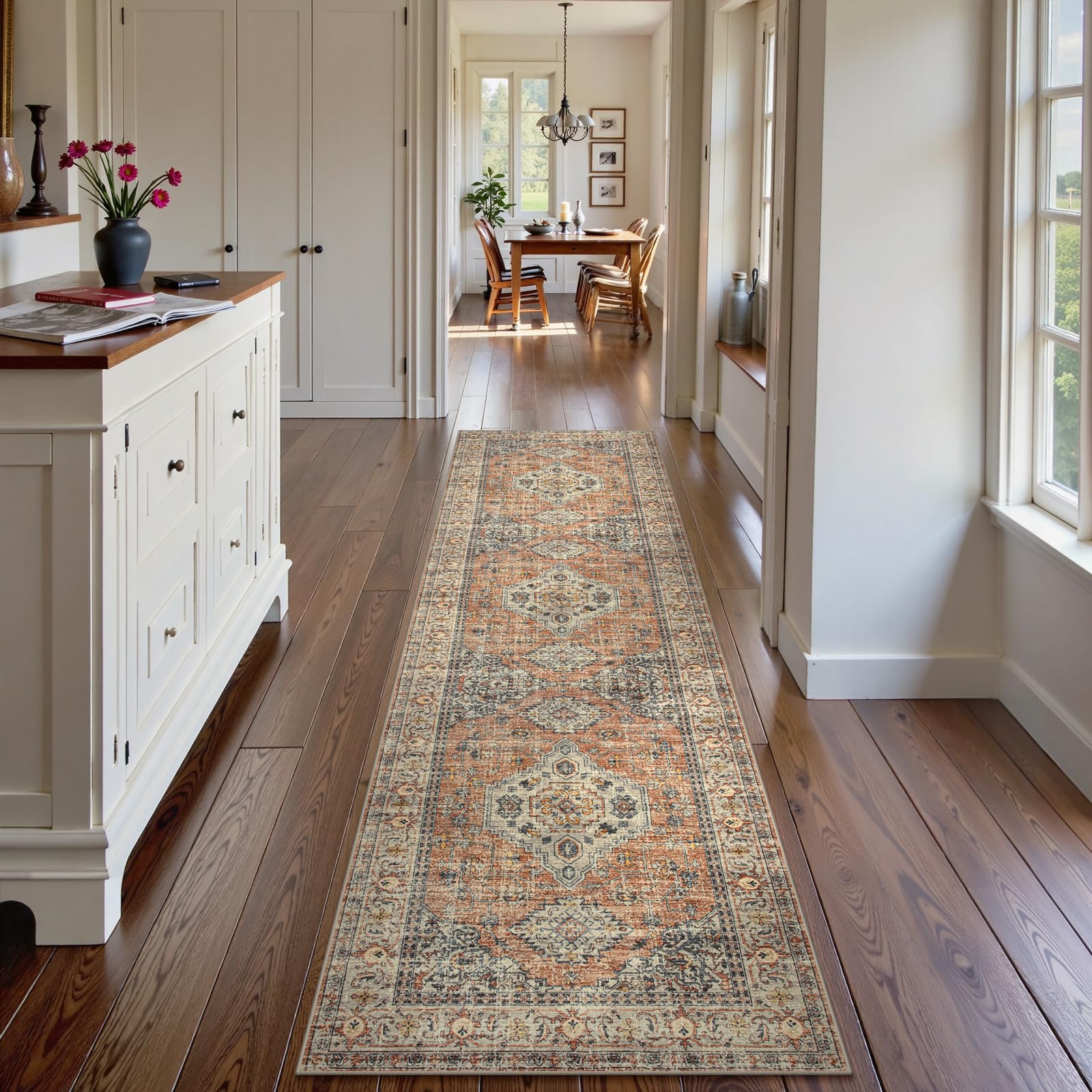 Lahome non-slip backing rug with peach-orange design keeps hall runners in place.