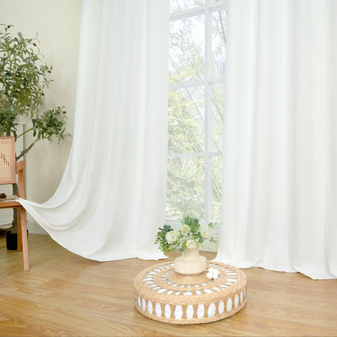 LAMIT linen-blend drapes drape gracefully, adding texture to interiors.
