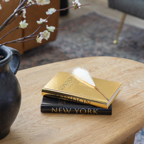 Lamour Home Decor blank-page faux books invite sketching and note-taking.