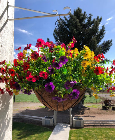 Lamsze artificial daisies in a hanging basket add vibrant color with low maintenance.
