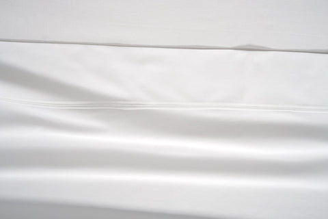 Lane Linen bed with white sheets for a hotel-inspired bedroom look