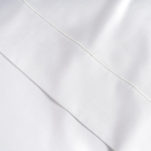 Lane Linen packaging uses a reusable cotton bag for sustainability.