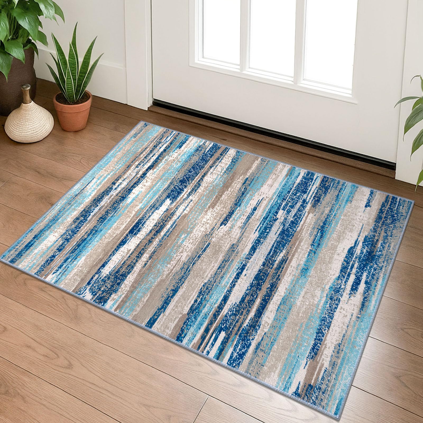 Lansny small abstract area rug in aqua and taupe for small spaces.