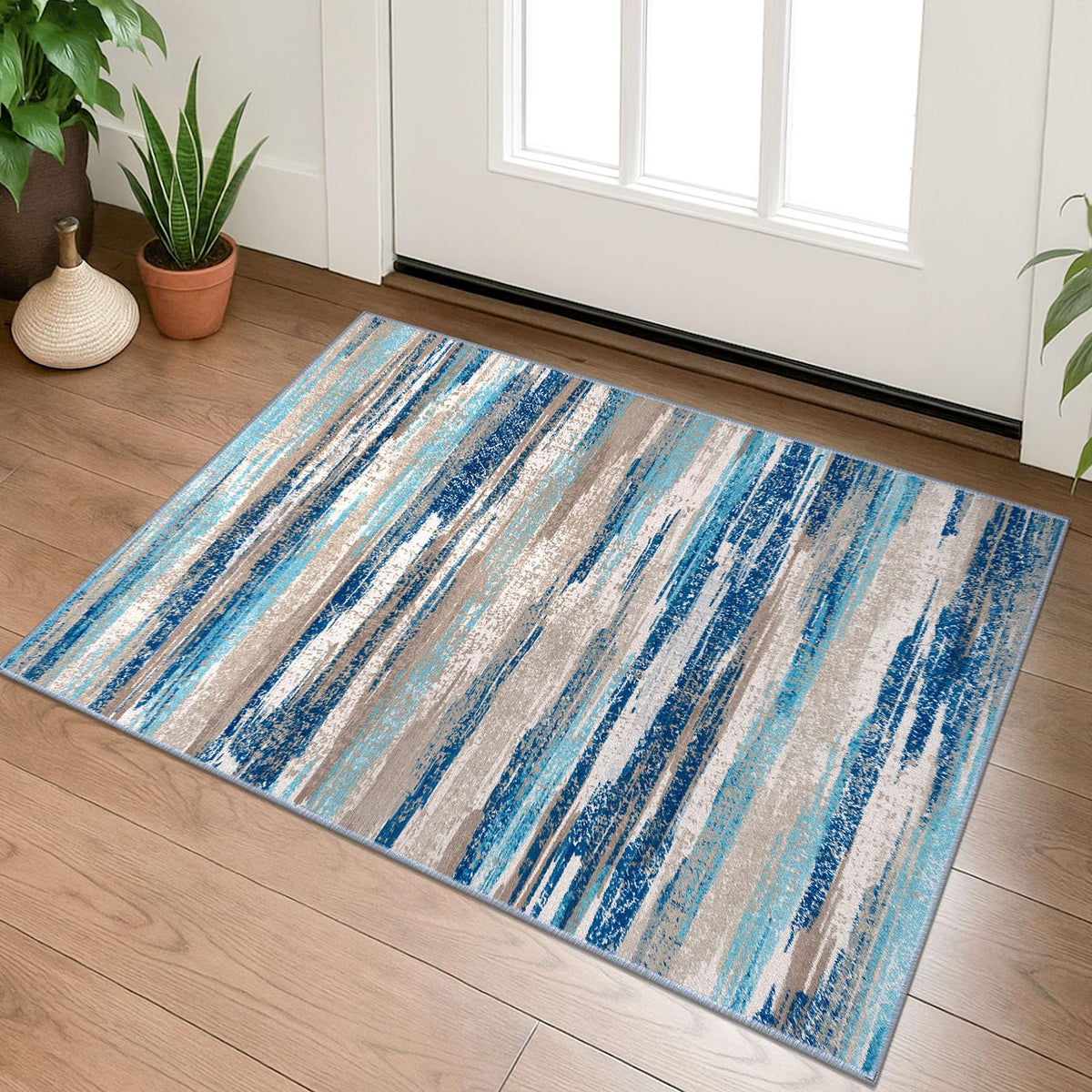 Lansny small abstract area rug in aqua and taupe for small spaces.