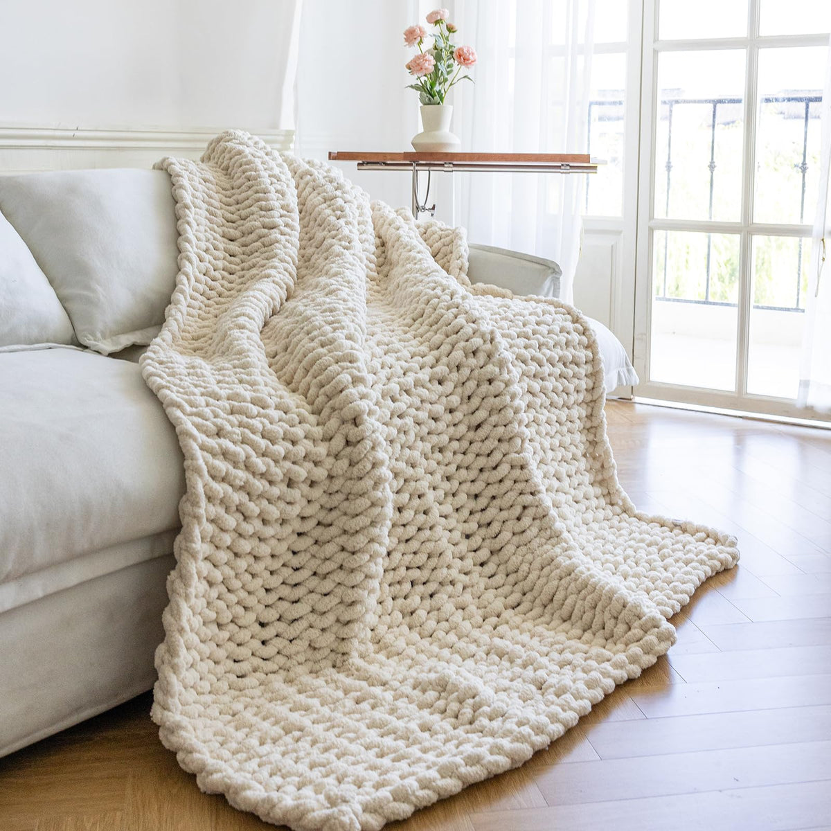 Larexius chunky knit blanket cream close-up shows soft chenille texture for cozy warmth.