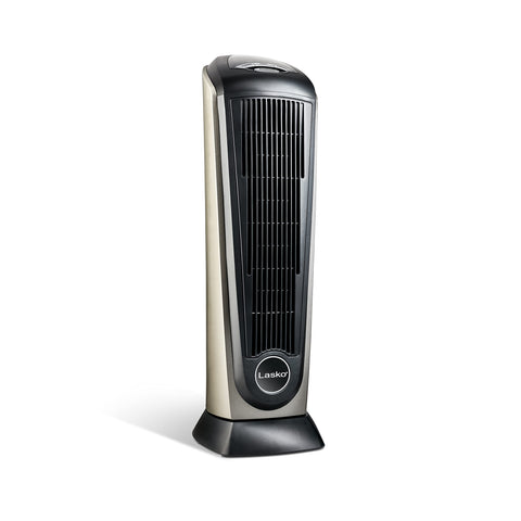 Lasko 1500W ceramic tower heater in a cozy bedroom setup
