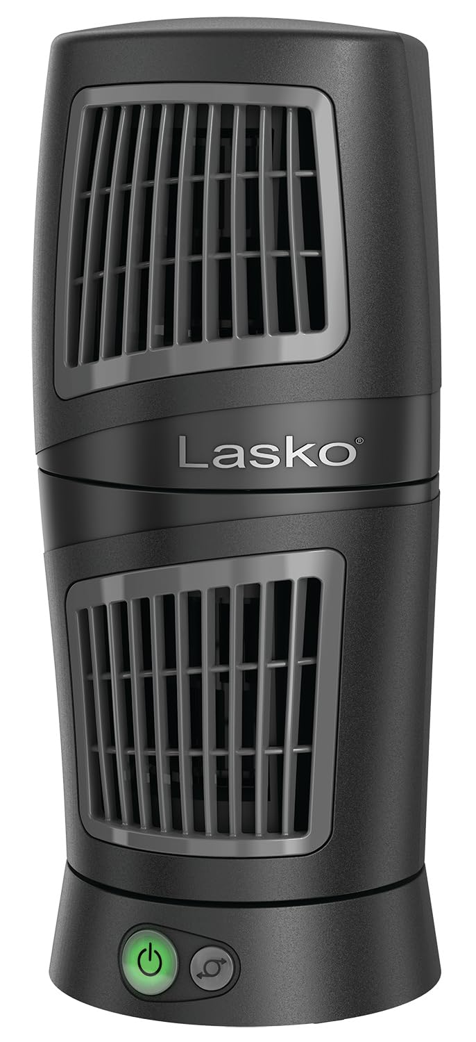 Lasko Twist-Top 12in tower fan in black on a desk providing compact cooling.
