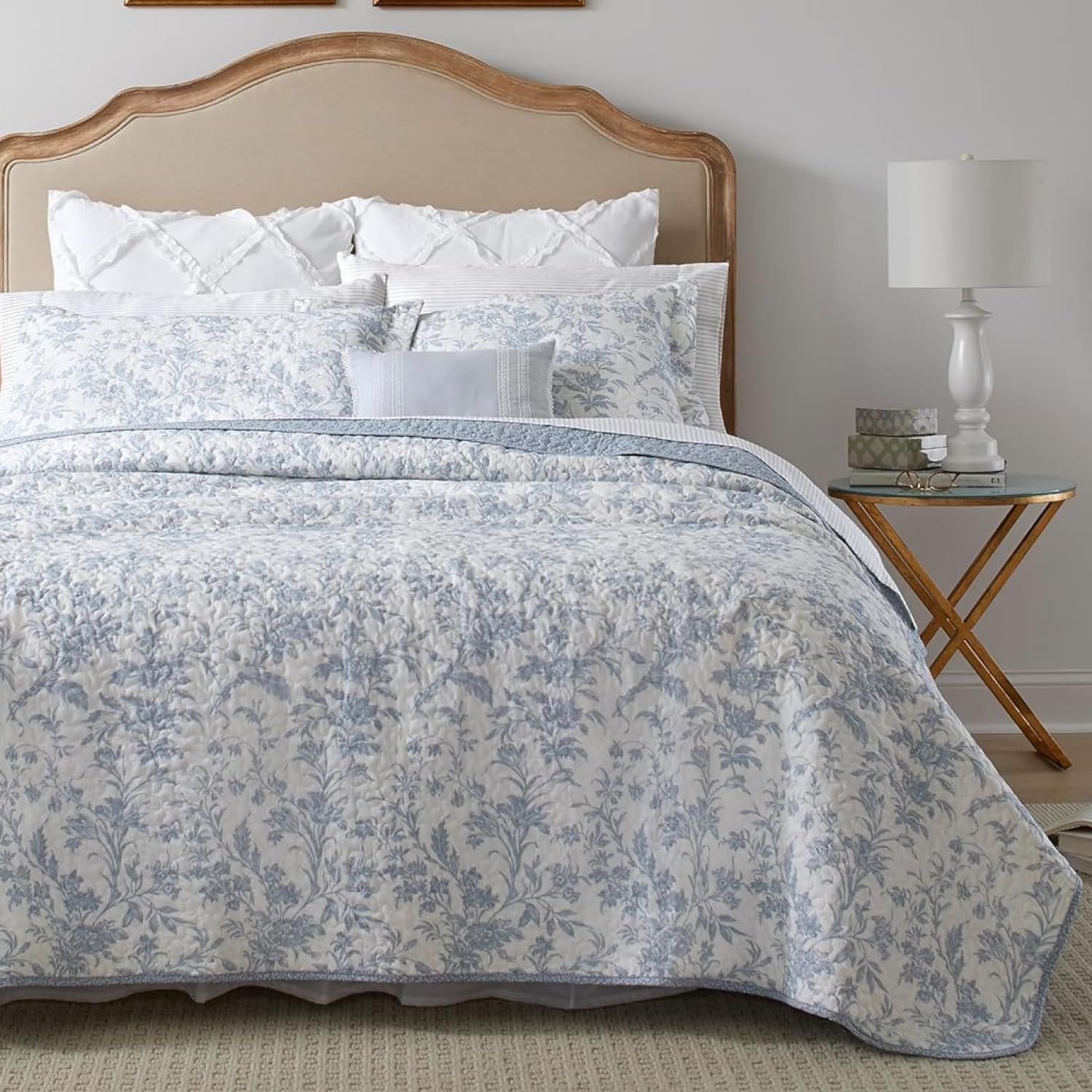 Laura Ashley Amberley Blue king quilt set on bed, showing soft cotton fabric and elegant color.