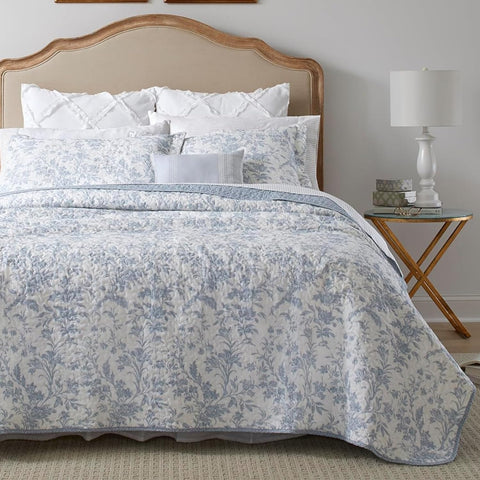 Laura Ashley Amberley Blue king quilt set on bed, showing soft cotton fabric and elegant color.