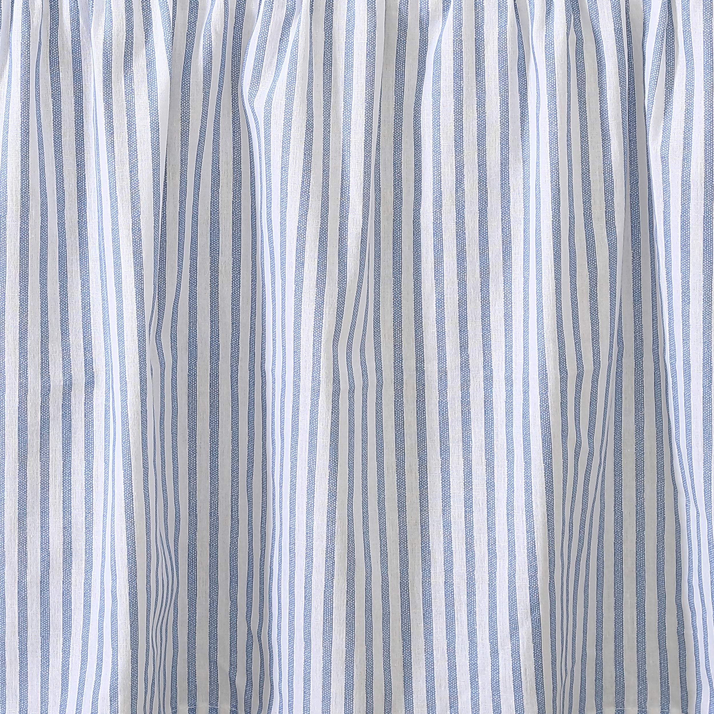 Laura Ashley bedskirt coordinates with surrounding bedding for cohesive styling.