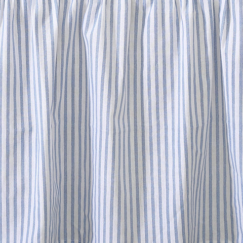 Laura Ashley bedskirt coordinates with surrounding bedding for cohesive styling.
