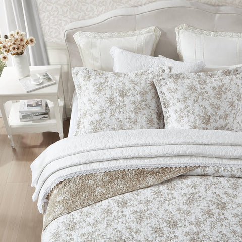 Laura Ashley quilt texture close-up highlights breathable cotton blend for everyday comfort.