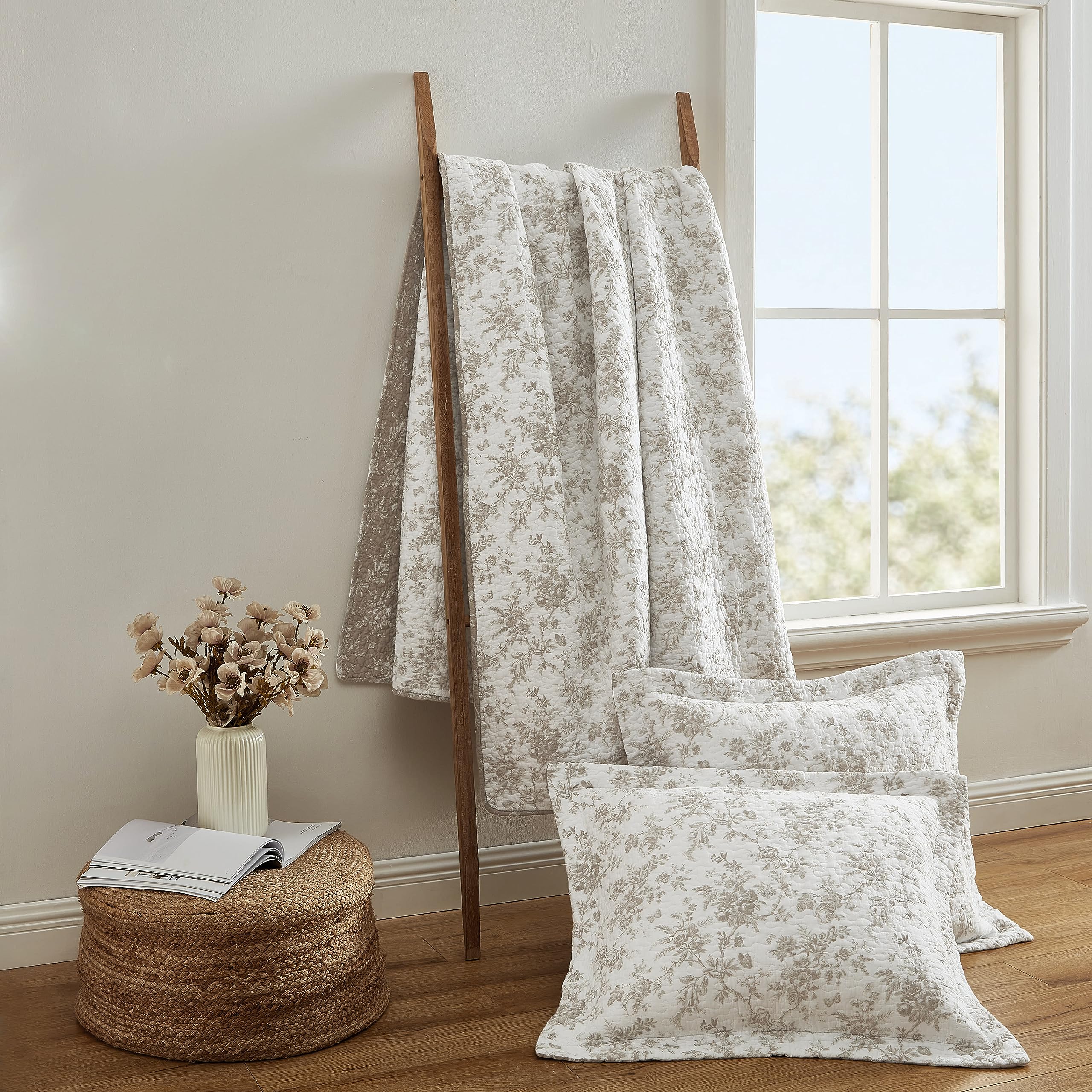 Laura Ashley king quilt set includes matching shams for a cohesive look.