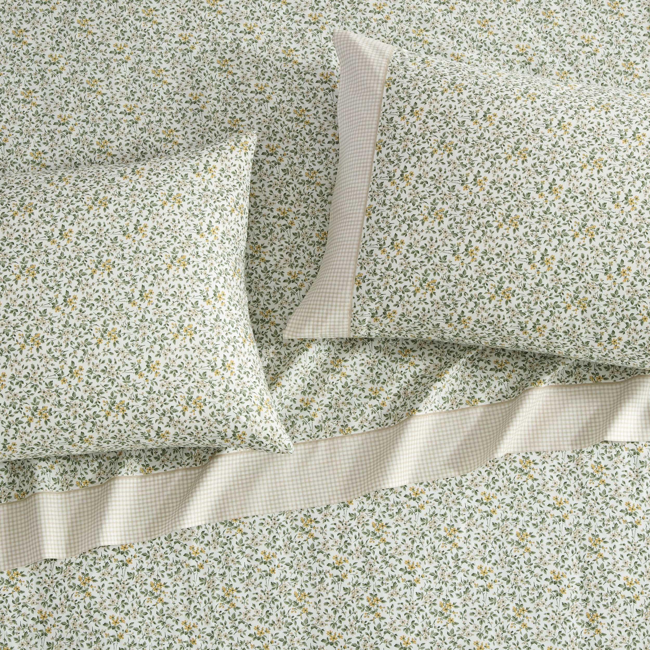 Laura Ashley fitted sheet deep pockets image shows secure fit around deep mattresses