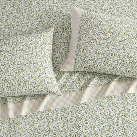 Laura Ashley fitted sheet deep pockets image shows secure fit around deep mattresses