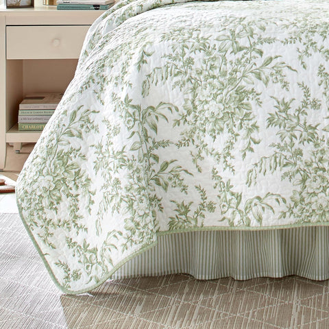Laura Ashley Queen Quilt Set laid on bed for a calm traditional bedroom ambience.