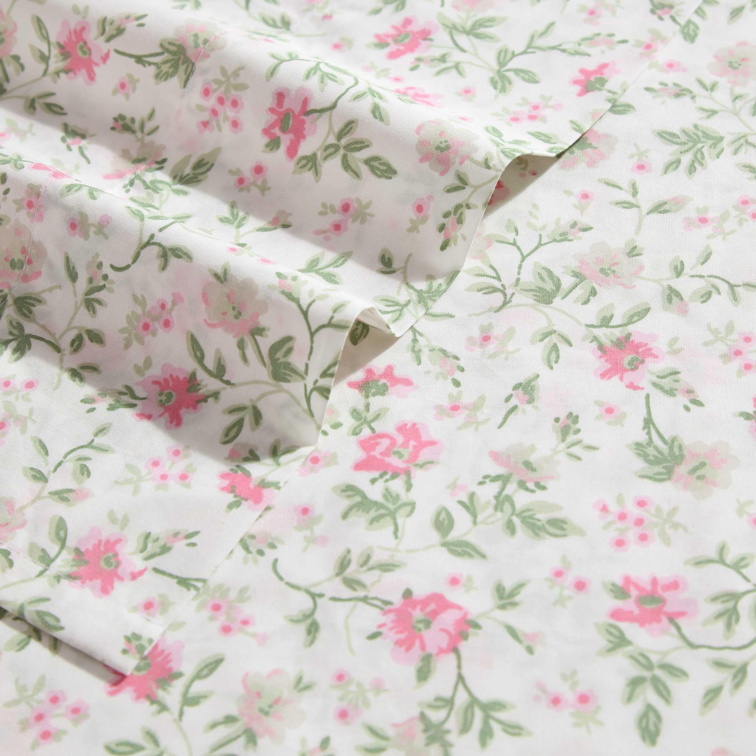 Fitted sheet pocket demonstrates secure fit for deep mattresses.