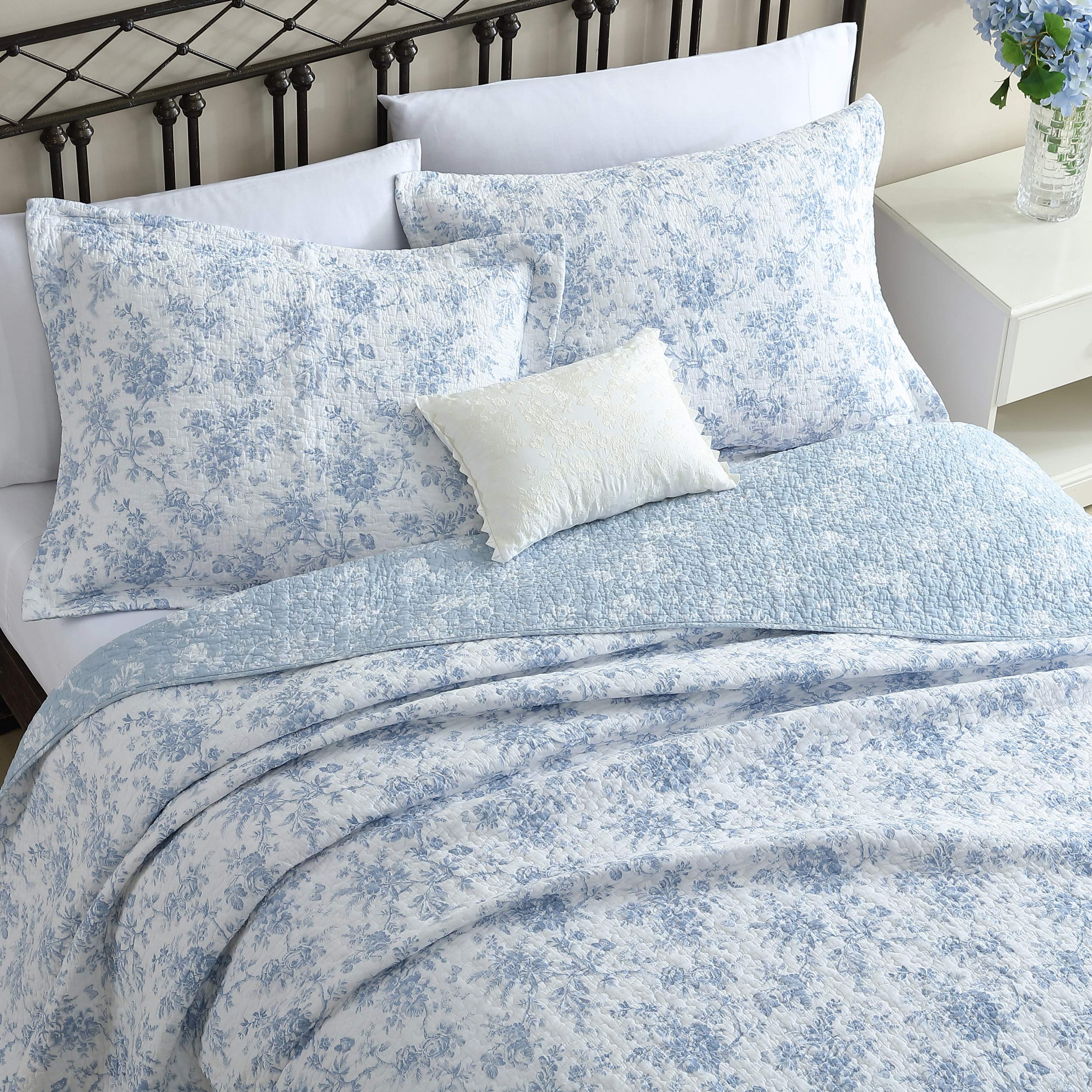 Laura Ashley reversible floral quilt backside visible for versatile décor choice