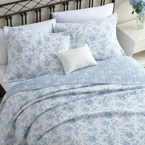 Laura Ashley reversible floral quilt backside visible for versatile décor choice