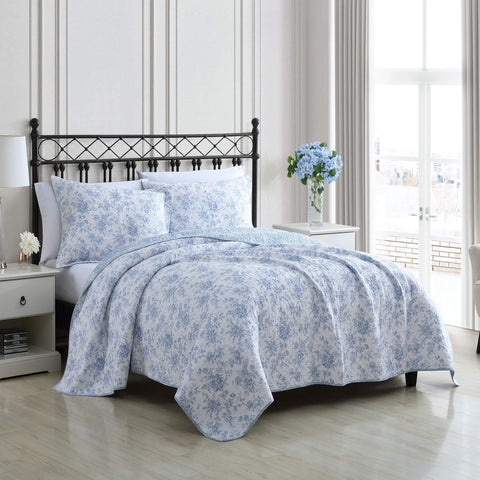 Laura Ashley reversible floral quilt blue side displayed to emphasize styling options