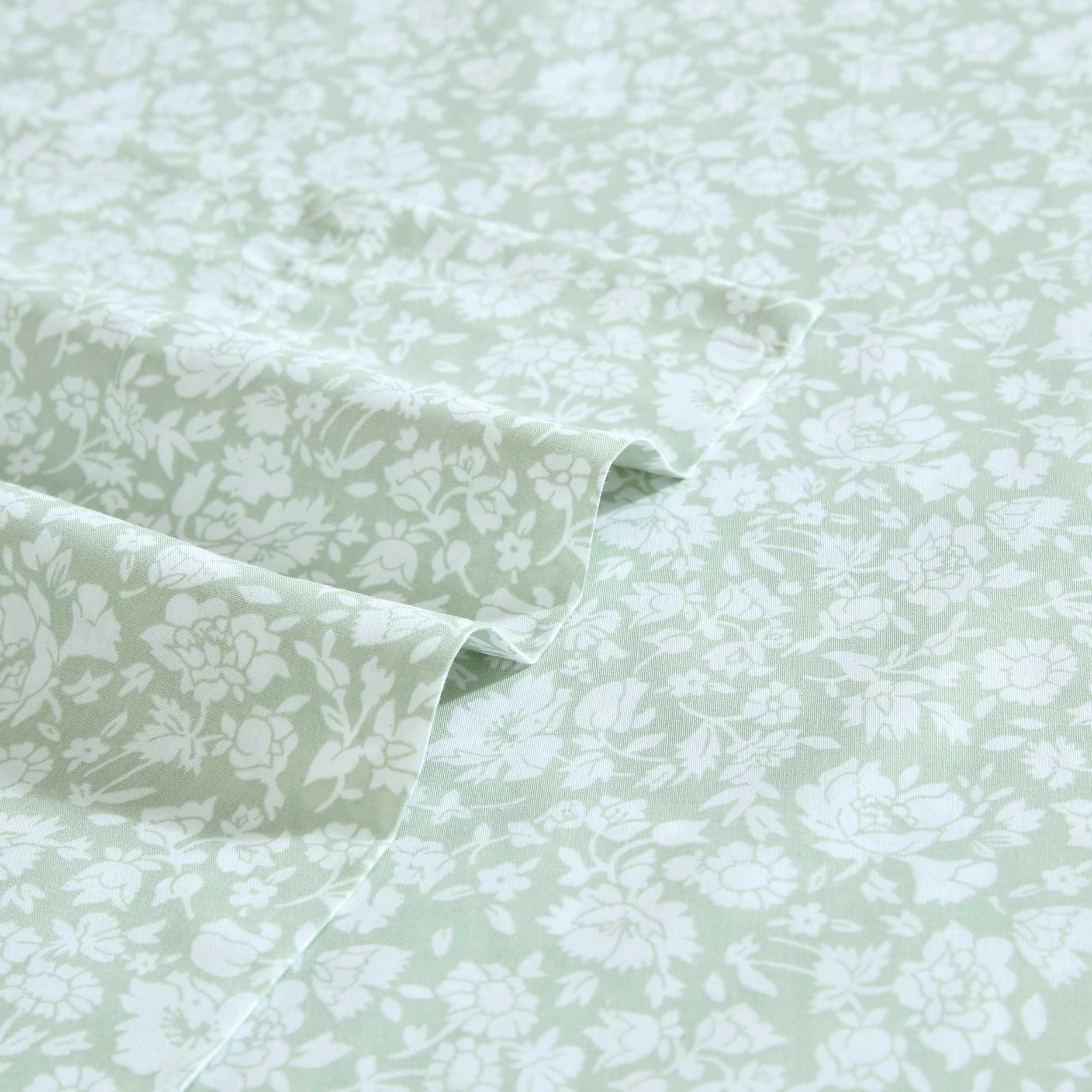 Bed setup with Laura Ashley heirloom-ditzy-green sheets for timeless elegance